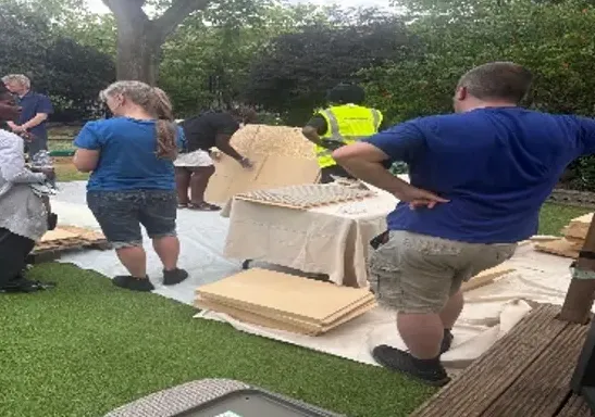 Cutting wood fibre boards on the lawn